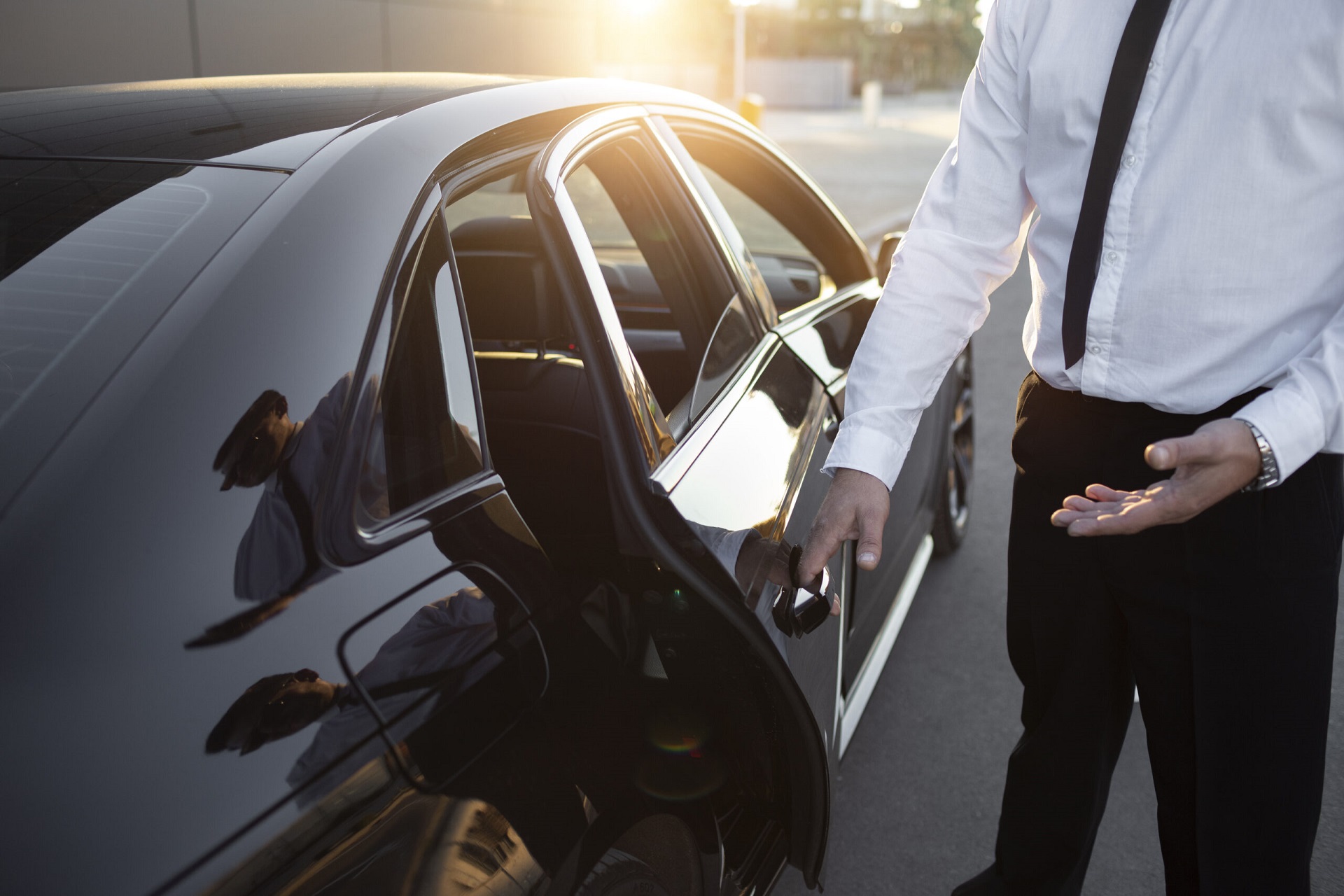 Driver with opened car door.